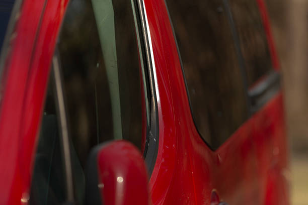 istock car mirror reflections, reflected street scene on glossy car surface 2241636445