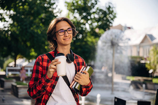 istock Feeling good, walking. Young student is outdoors at daytime 2241637116
