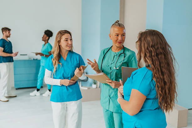 istock Healthcare workers collaborate and share ideas in a bright hospital setting 2241638698