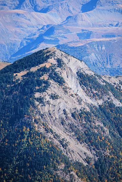 Majestic mountain ridge with steep forested slopes