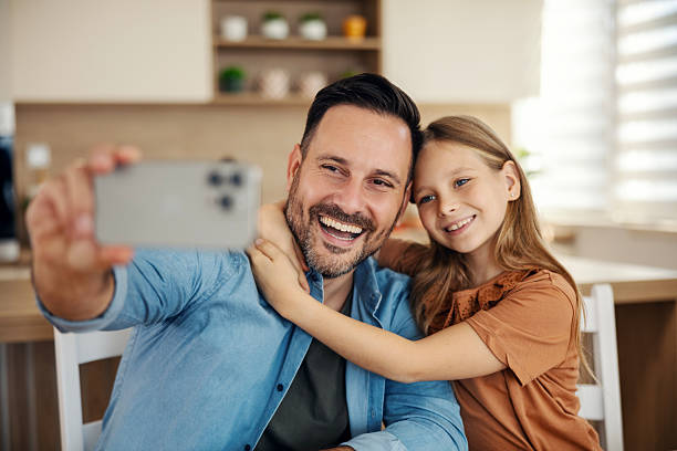 istock Father and daughter taking a happy selfie together 2241641389