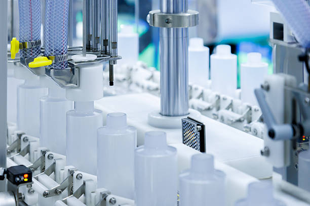 istock robot arm moving plastic bottle to conveyor belt of auto capping and labeling machine at cosmetic and skin care manufacturing. cosmetic industry and ai technology machinery concept. 2241642321