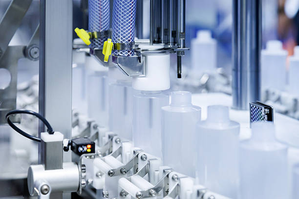 istock robot arm moving plastic bottle to conveyor belt of auto capping and labeling machine at cosmetic and skin care manufacturing. cosmetic industry and ai technology machinery concept. 2241642358