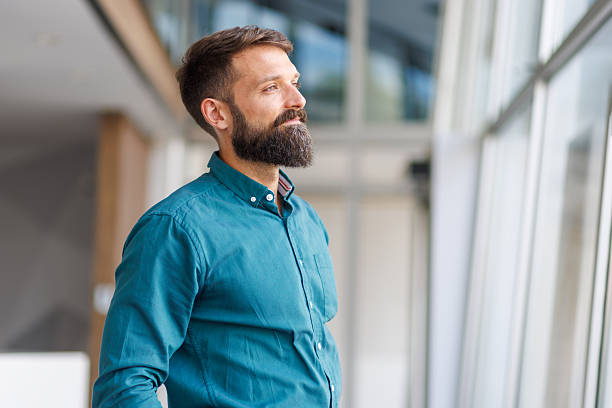 istock Thoughtful businessman looking away, contemplating future vision 2241648669