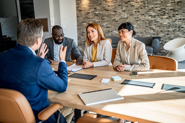 istock Business colleagues collaborating on project in office meeting 2241648848