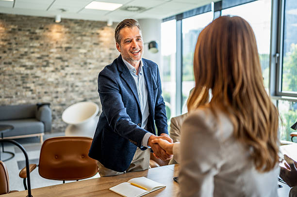 istock Business people shaking hands in office meeting 2241650202