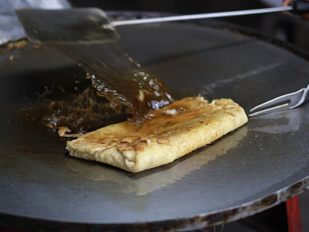 istock The process of making or cooking an Martabak Telur. 2241651116