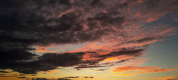 istock Sunset Clouds background. Dramatic Clouds Sunset Background. Sky with clouds in Sunrise. Sunrise with clouds in various shapes background. Calm Cloud. 2241651914