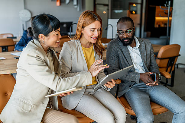 istock Diverse business team collaborating on digital tablet in office 2241652194