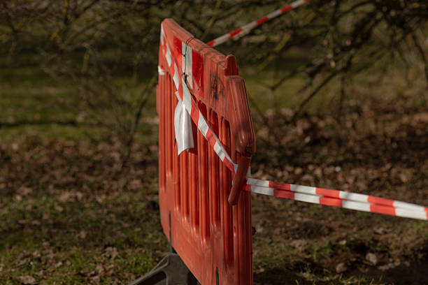 istock restricted park access, maintenance barrier restricting park walkway 2241655756