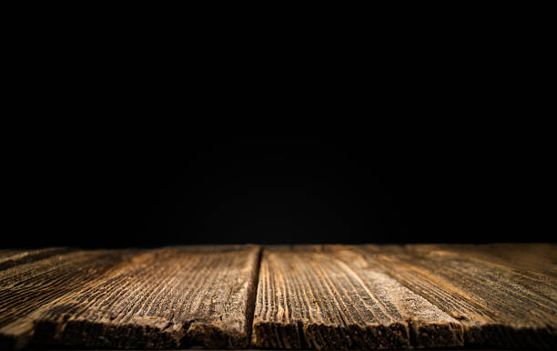 istock Old wooden table with dark background. Halloween table. Empty space. Place for product. 2241665938