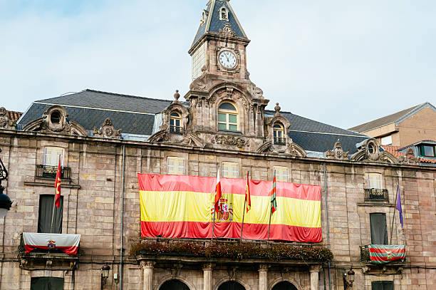 Torrelavega city hall building, Cantabria, Spain, with a large Spanish flag