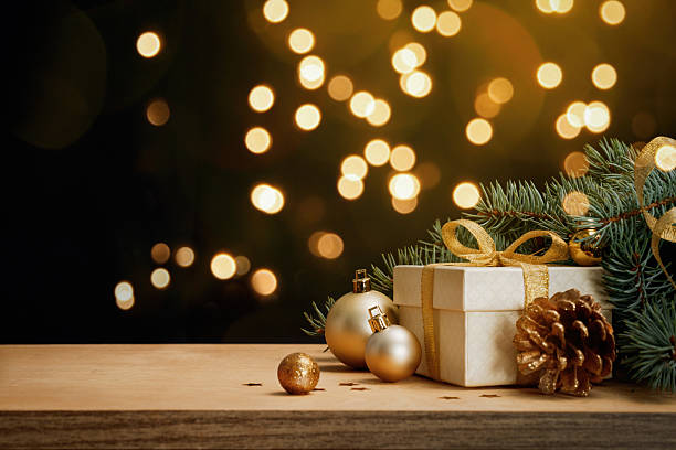 istock Christmas gift box with golden decorations and festive lights 2241666505