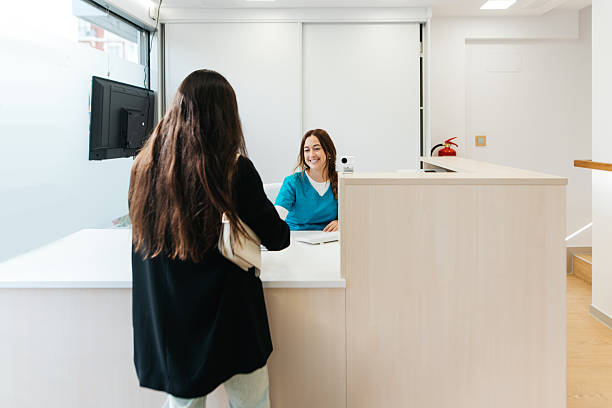 istock Patient at a medical center reception 2241667397