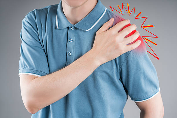 istock Dislocation of the shoulder, joint inflammation, arthritis and degenerative changes, man with pain in his arm on gray background 2241667805