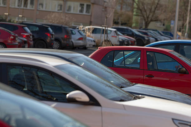 istock closeup of vehicles and reflective windshields in city environment 2241667843
