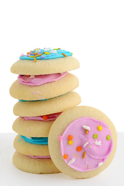 istock closeup stack of colorful sugar cookies with sprinkles on white 2241669149
