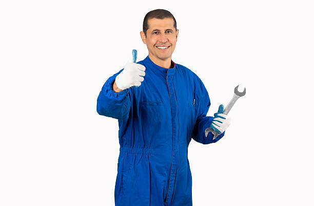 istock Mechanic posing with a wrench in his hand 2241669329