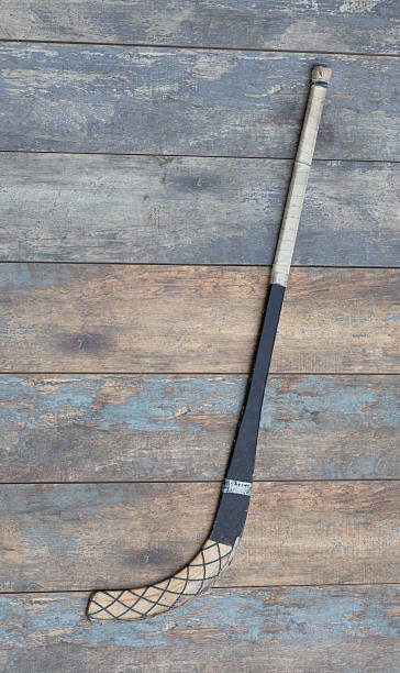 istock bandy stick on  wooden background 2241675042