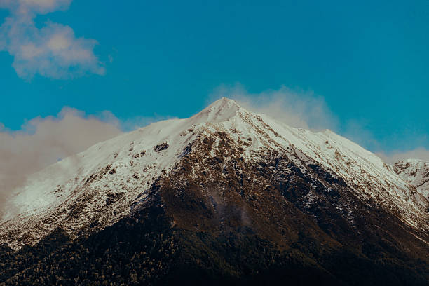 Snow Capped mountain top in doubtful sound in New Zealand