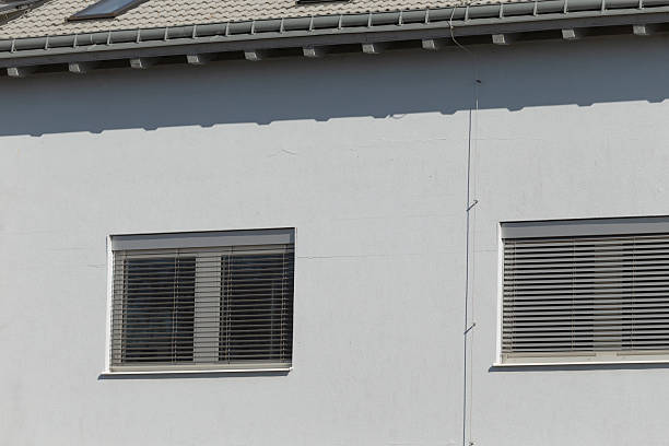 istock elegant urban residential facade with windows and subtle shadows 2241677716