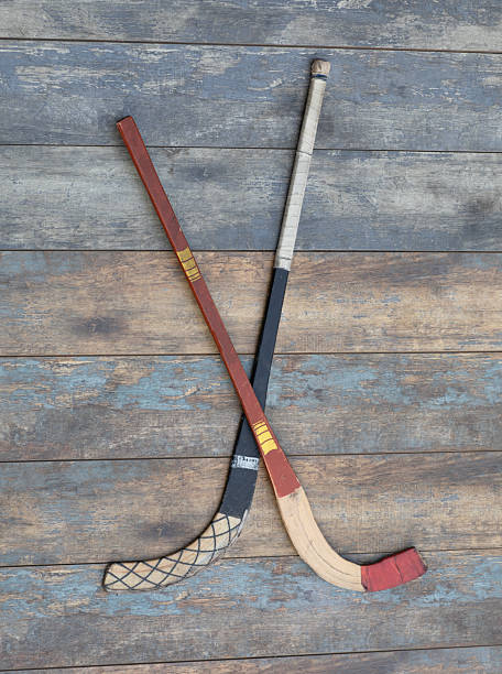 istock bandy stick on  wooden background 2241677736