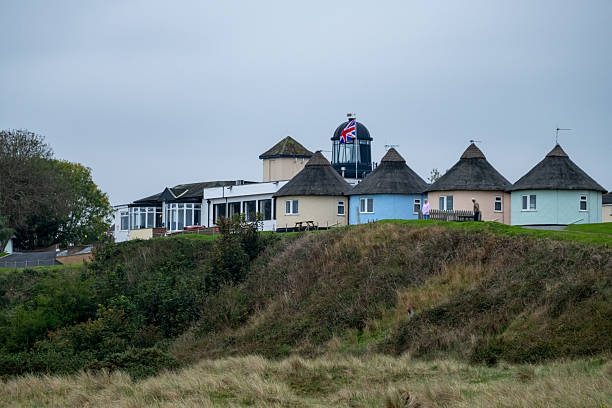 Winterton, Norfolk, UK - October 11 2025. Colourful round houses in the sand dunes used as holiday lets on the Norfolk coast