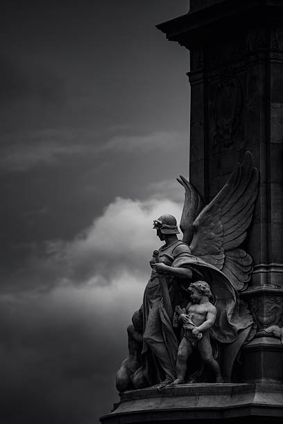 London, United Kingdom - October 14,  2022 - Black and white image showcasing a portion of the Victoria Memorial in London, a monument dedicated to Queen Victoria, located at the end of The Mall in front of Buckingham Palace, sculpted by Sir Thomas Brock and unveiled in 1911.