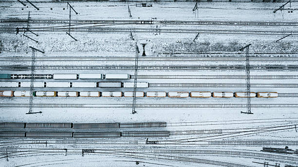 istock Overhead shot of a snowy railway yard featuring freight trains on multiple tracks, Vilnius, Lithuania 2241685353