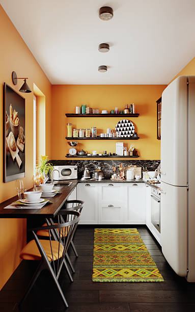 Orange Kitchen with White Cabinets, Retro Fridge and Colorful Runner