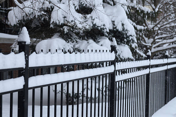 istock Snowy Black Fence Scene 2241686110