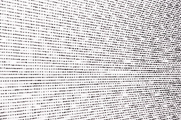 Macro image of black halftone lines curving across white paper, forming a flowing horizontal pattern with varied dot density.