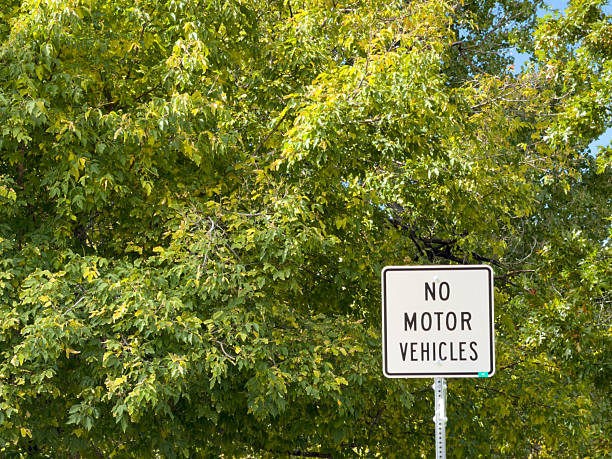 istock No motor vehicles sign restricting access to park area 2241688659