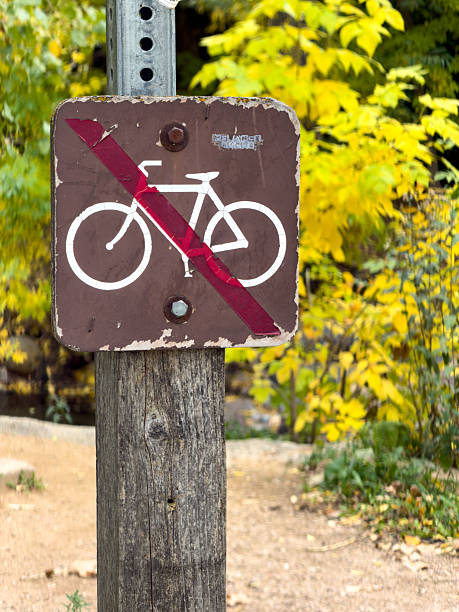 istock No cycling sign post restricting bicycle access on trail 2241689507