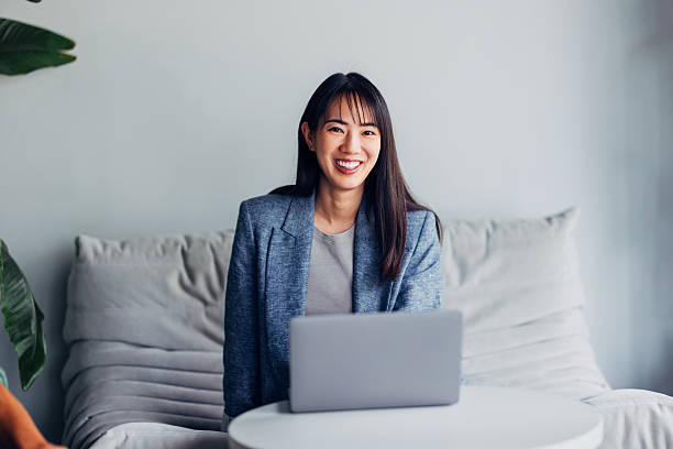 istock Confident Woman Working on Laptop in Minimalist Modern Interior 2241691474