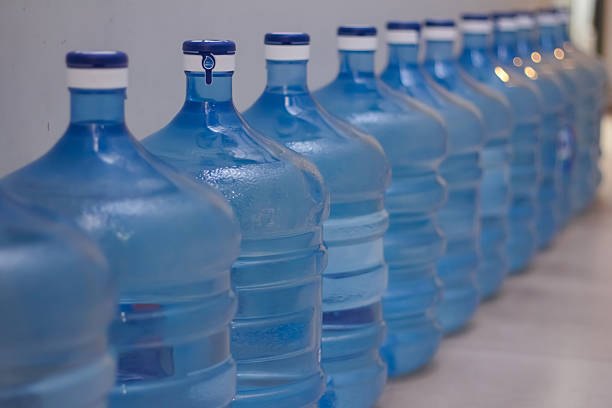 istock A row of blue plastic water gallons 2241699872