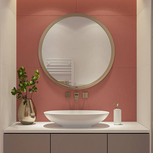 istock Compact Luxury Bathroom with Round Mirror and Elegant Wash Basin 2241704289