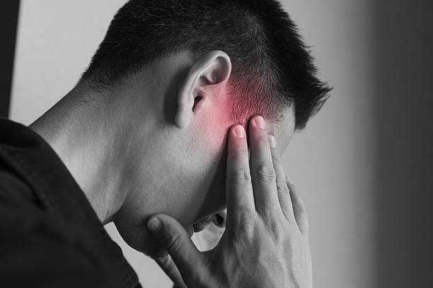 istock Man covering his face having a headache, stress, migraine. 2241704716