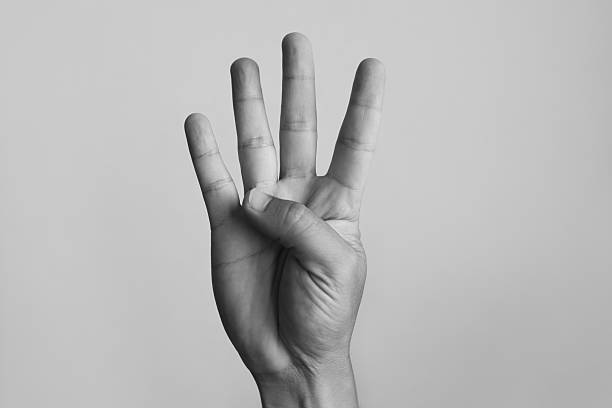 istock Hand sign gesture showing 4 fingers on white background. 2241704733