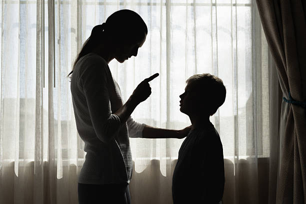 istock Mother correcting her son who is being misbehaving. 2241704746