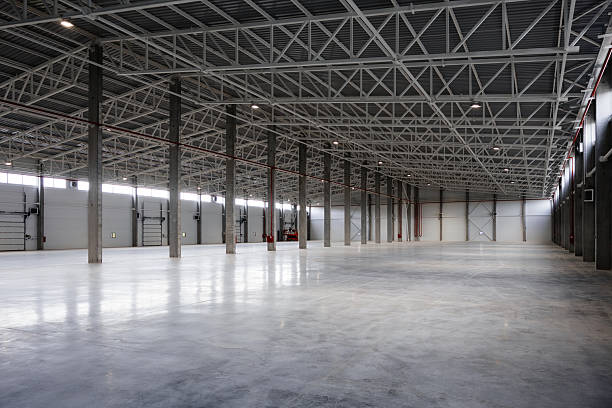 istock Big new empty industrial building, warehouse or commercial space 2241705646