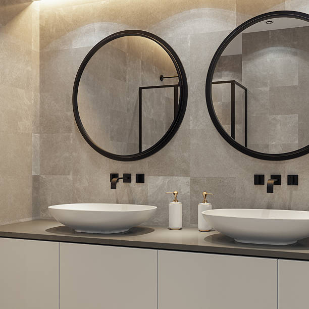 istock Spacious Bathroom with Double Vanity and Round Mirrors 2241708379