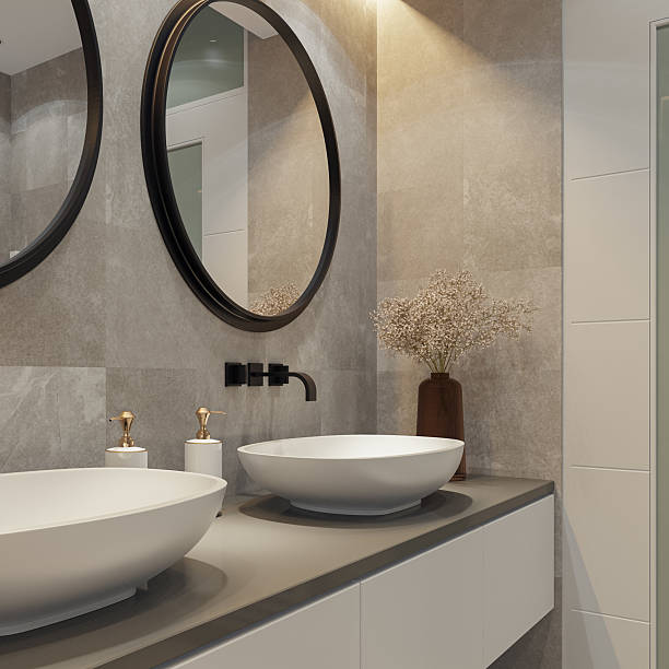 istock Spacious Bathroom with Double Vanity and Round Mirrors 2241708428