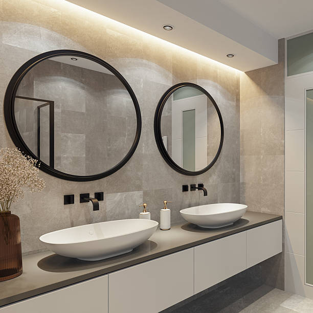 istock Spacious Bathroom with Double Vanity and Round Mirrors 2241708450