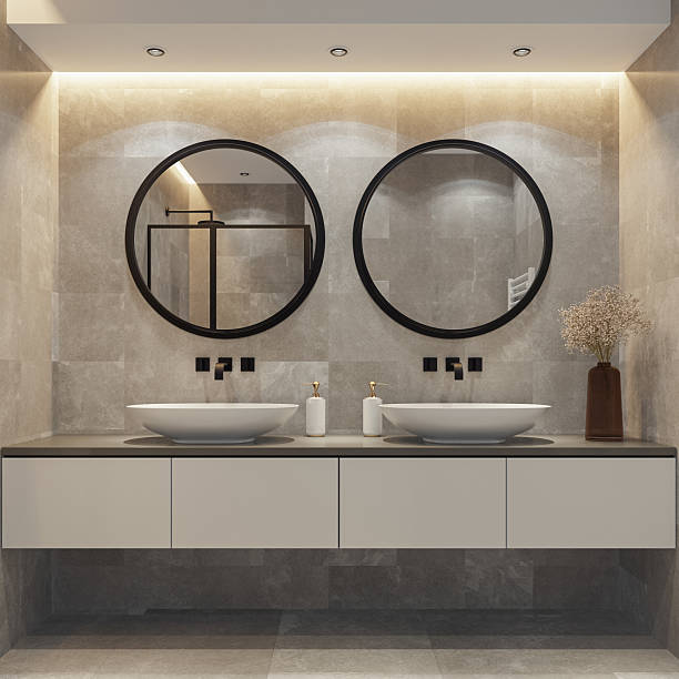 istock Spacious Bathroom with Double Vanity and Round Mirrors 2241708473