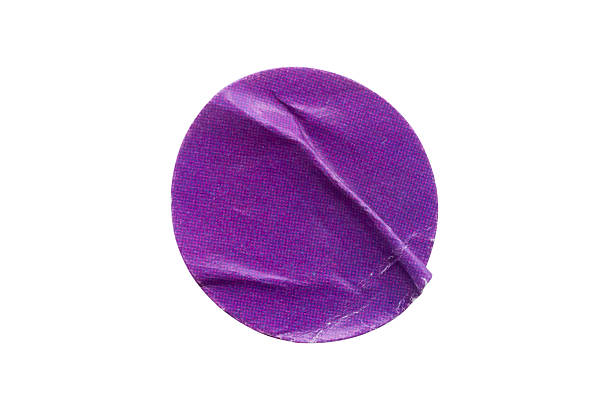 istock Blank purple round adhesive paper sticker label isolated on white background 2241708697