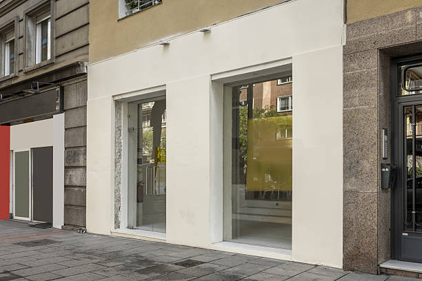 Commercial premises at street level with light painted walls and large rectangular windows