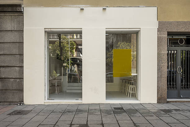 Commercial premises at street level with light painted walls and large rectangular windows