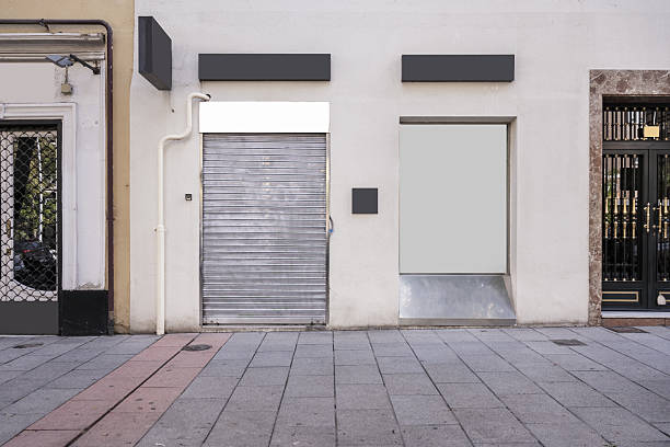 Front facades of a commercial premises with metal mesh closure
