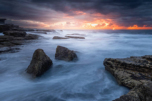 istock Stormy ocean sunrise turbulent sea 2241711993